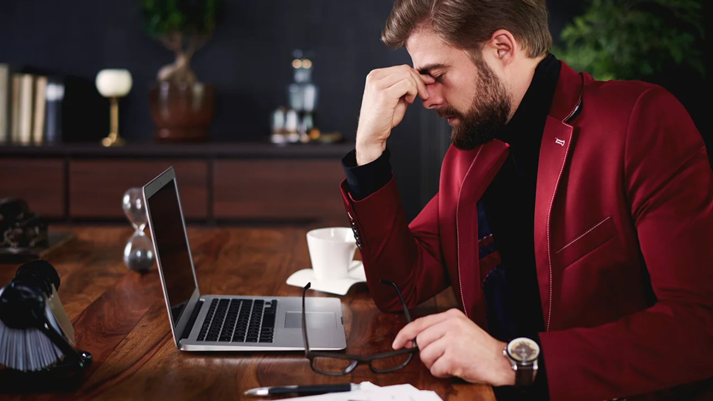 exhausted-businessman-his-office