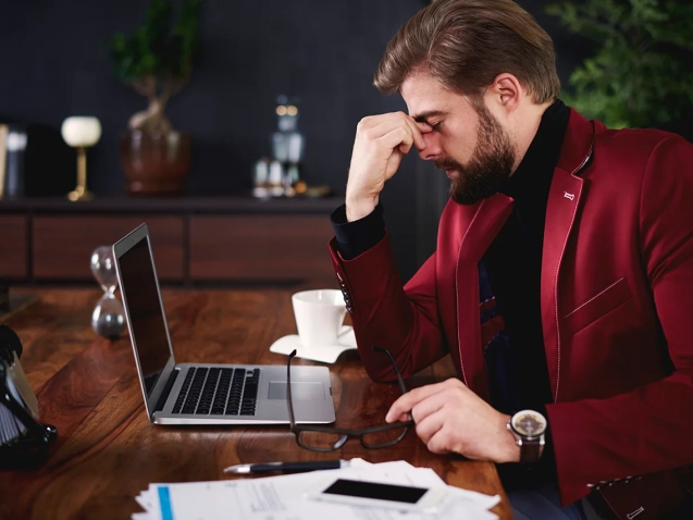 exhausted-businessman-his-office